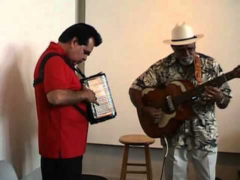 Andy Cardenas and Rudy Lopez performing Cachita at the Carver Community Center