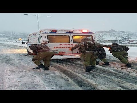 Awantipora: Police assist people stuck due to snowfall