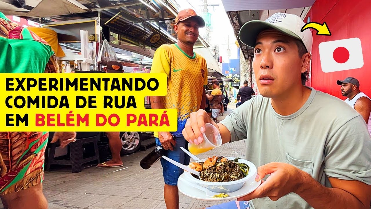 Um japonês experimentando comida de rua em Belém do Pará