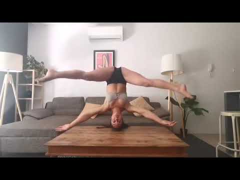 Woman Performs Split-Legged Headstand - 1141676-5