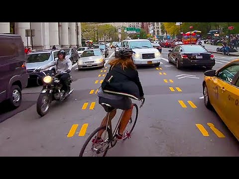 Bike Messenger Riding Fast and Fluid Through NYC Traffic