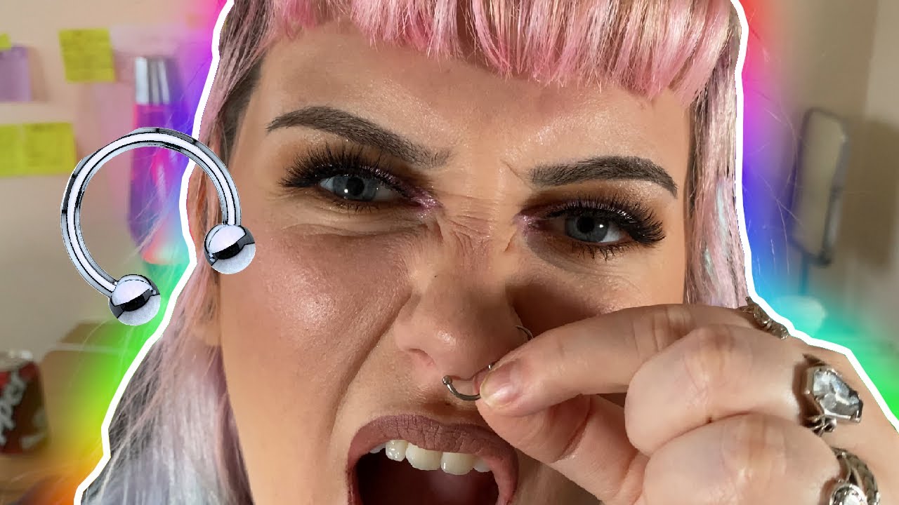 Shoving my septum piercing back in after two years (OUCH)