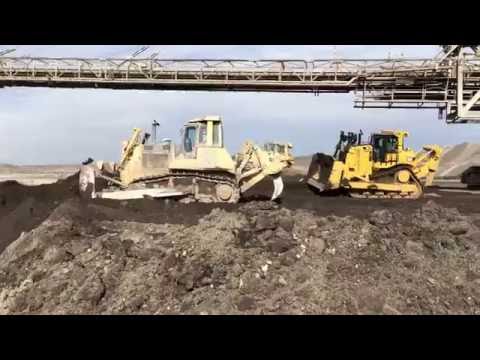 Caterpillar D9T Dozer Working With Komatsu D275AX And Cat D7R