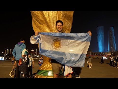 Fans outside the stadium react and celebrate after Argentina's World Cup win