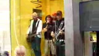 Band in HMV window in London