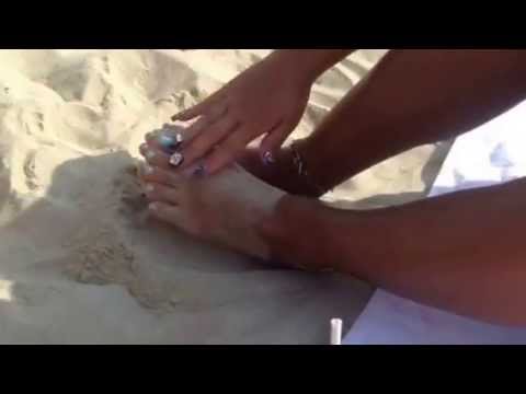 Lovely feet at the beach