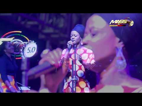 Sola Allyson leads worshippers in the rain at MASS 5.0 Concert Tour of Ibadan