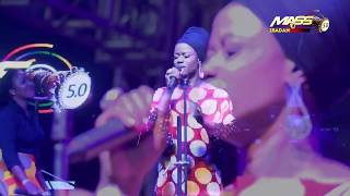 Sola Allyson leads worshippers in the rain at MASS