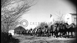 Civilians gather to see marching Yugoslav troops. HD Stock Footage
