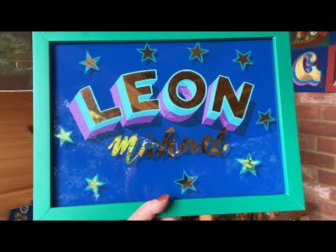 Reverse Glass Gilding overview of a name in gold leaf