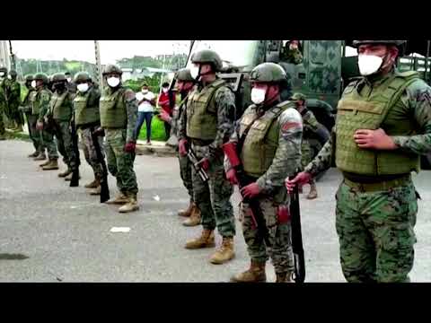 Ecuador prison gang riots kill scores of people