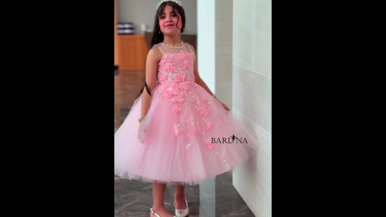 Pink girl's dress decorated with flowers and sparkly embroidery - year 1