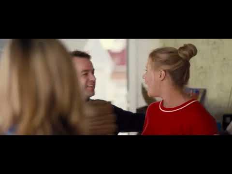 Trainwreck trailer still highlighting Amy and Aaron's contrasting worlds, with music underscoring tone shifts