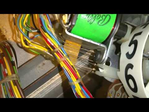 Adjusting pinball machine score reel