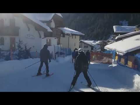 Skiing into Selva di Val Gardena