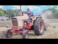 CASE TRACTORS HARVESTING HAY