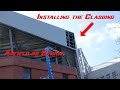 Anfield road stand extension. Installing the Cladding