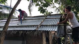 JAMES AND JESSICA WORKING ON THEIR ROOFING THAT LEAKING DURING A HEAVY RAIN