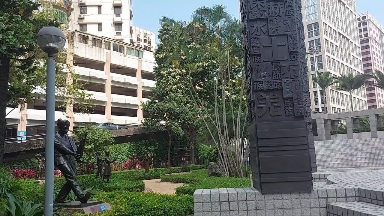 A peaceful walk through Dr. Carlos d'Assumpção Park with trees and fountains