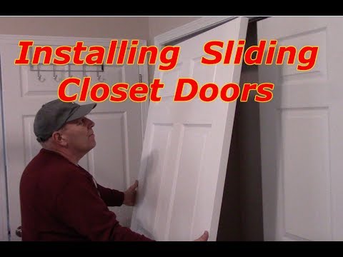 image-How do you hang a sliding closet door on a track?