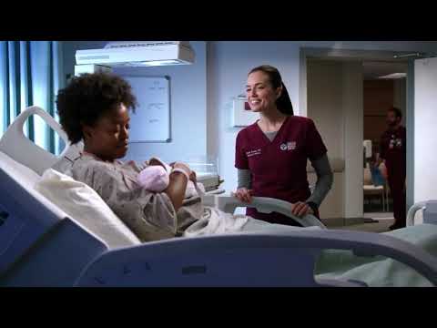 Dr Manning defends a woman and her newborn baby from a police officer in order to prevent separation