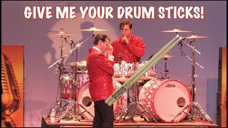 Drummer goes crazy and the singer threatens to take his drum sticks!