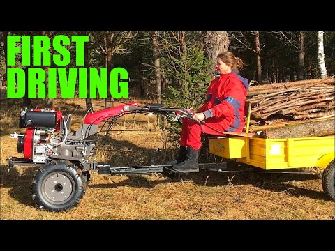 Two wheel tractor driving lesson. The forest work at homestead