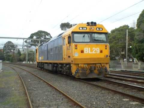 Light Eng BL29 passing METRO B76 ballast train