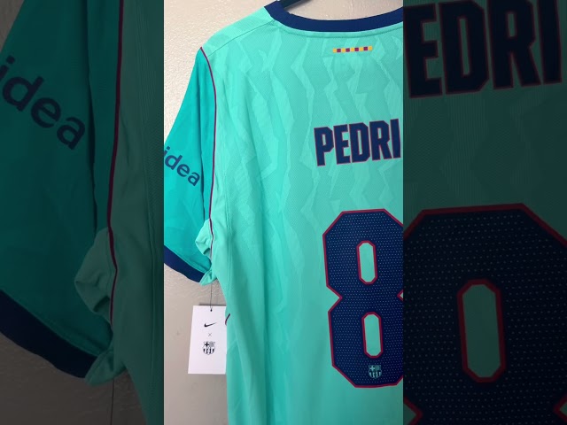Vídeo relacionado con FC Barcelona Camiseta Naranja Tercera Equipación Adulto Temporada 25/26 Réplica Oficial Pedri Unisex Talla S Poliéster Cuello Redondo