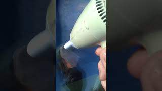 Removing condensation from a double glazed window