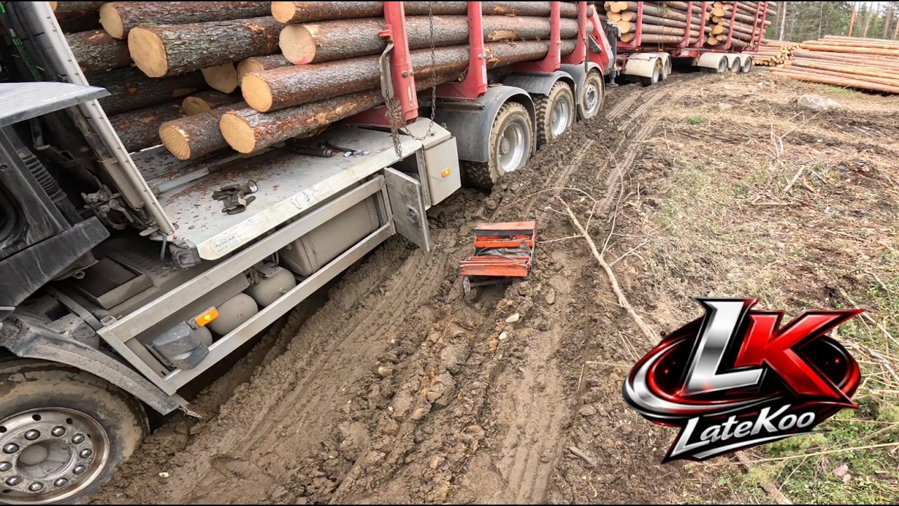 TUKKIAUTO JÄÄ KIINNI TÄYDESSÄ LASTISSA - Metsäkoneella hinaaminen