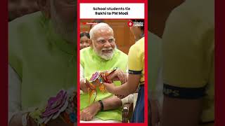School students celebrate Raksha Bandhan by tying 'Rakhi' to Prime Minister Narendra Modi.