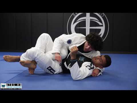 Half guard pass using the lapel to mount + collar choke - Mike Carbullido