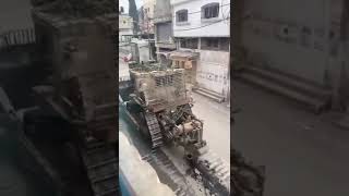 Download lagu An IDF D9 bulldozer in a Gaza street, successfully detonating a hidden, boobytrapped IED mp3