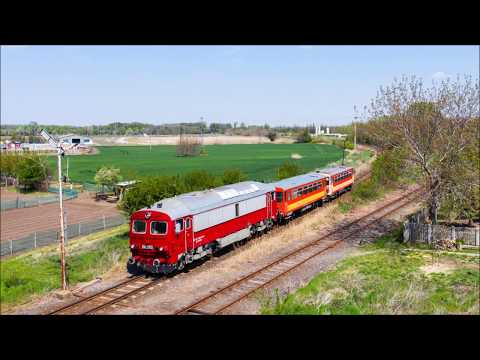 418 103 egy Békéscsaba - Újszeged személyvonattal tart Szőregre egy permetezővonatért Mezőhegyesnél