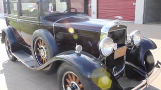 1931 Maroon & Black Durant Automobile with wooden spokes
