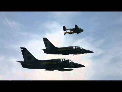 Yves "Jetman" Rossy flies in formation with jet planes