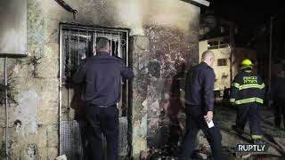 כבאים ישראלים במקום לאחר שריפת בית כנסת בלוד