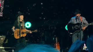 George Strait and Willie Nelson perform together for the first time.