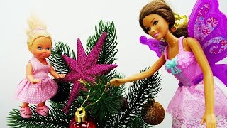 Kids' toys. Barbie dolls decorate a Christmas tree.