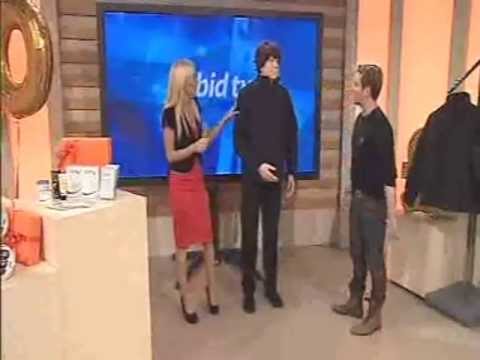 mannequin-man performming as a Living Mannequin: Carmel Thomas and guest presenter Andrew Stone encounter a mannequin that moves while selling a coat on bid-tv for bid-tv on 12/10/2010