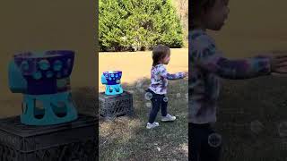 October 7, 2023 Kids playing with the bubble machine in the back yard