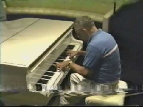Zack playing piano on the QE2, 1989