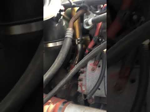 Freightliner Detroit 60 engine water pump rear hose replacement.