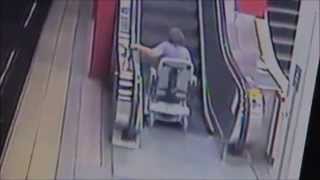 woman in wheelchair on escalator is a slinky