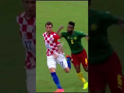 Cameroon players fighting their Croatian opponents