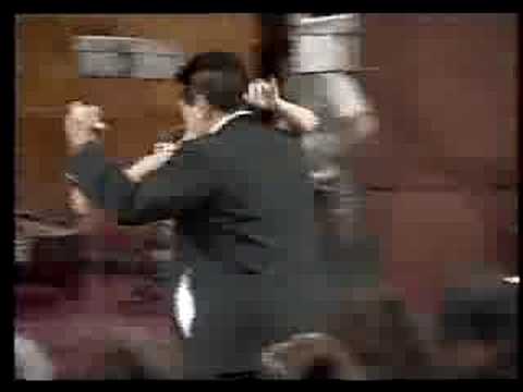  Alejandra Gutty  and  El Pibe Avellaneda  are  dancing  to  the  tango  "  Charamusca  "  by  Juan D'Arienzo