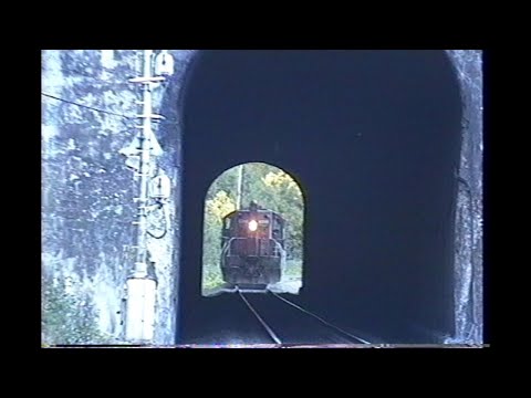 1187. SOUTHERN PACIFIC SP 4427 HELPER at Tunnel # 6 by Cruzatte Oregon on October 3 1993 with 2 frei