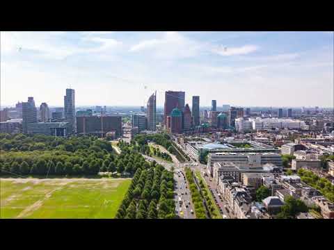 Aerial hyperlapse flying above The Hague city center in the Netherlands, to Financial District and
