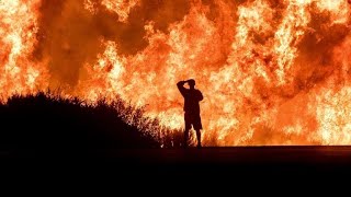 California fires: Crews race to contain flames with winds set to pick up